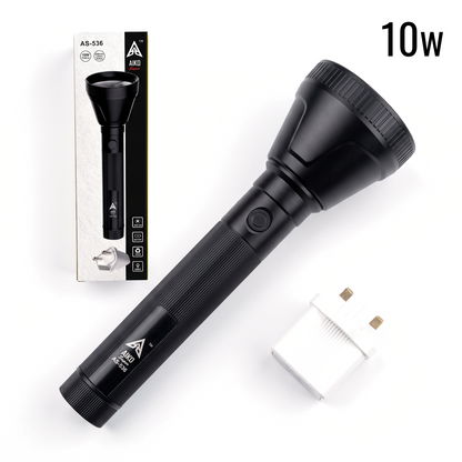 A black handheld flashlight shown diagonally on a white background, alongside its retail box and a small white power adapter. The flashlight has a textured grip, a ribbed head, and visible branding that reads A2S.